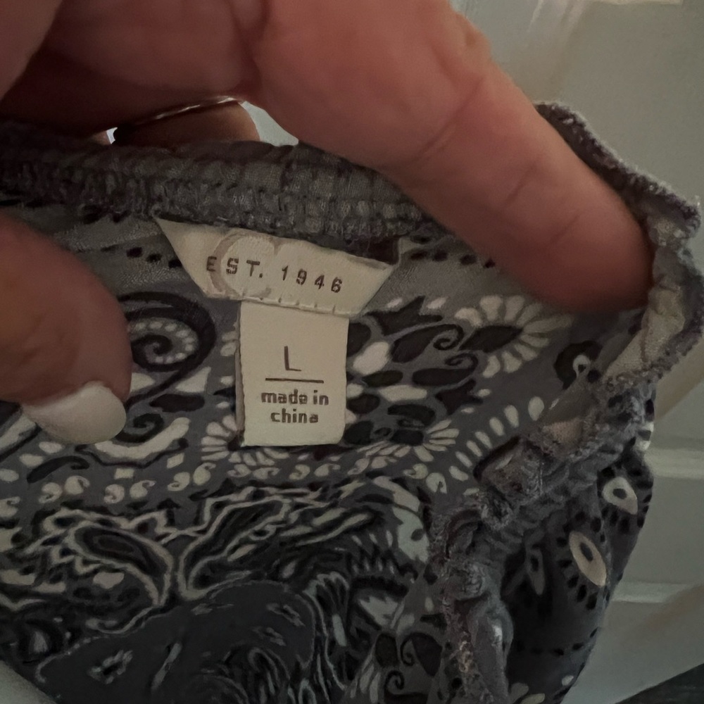 Cute top, in a blue denim scarf print. Wear with shorts or slacks